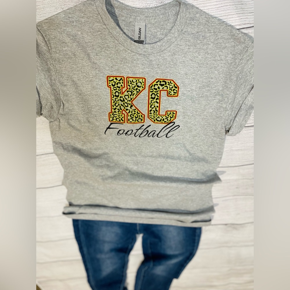 KC football shirt, cheetah print, yellow, red, black, football,